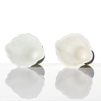 A pair of blanc de chine rhinoceros libation cups, Qing dynasty, Kangxi (1662-1722).