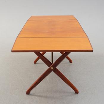 A teak veneer and stained beech dining table, mid 20th Century.