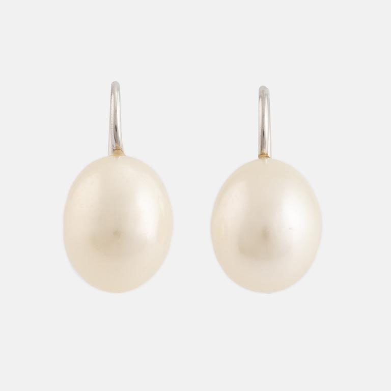 A pair of white gold earrings with cultured pearls.