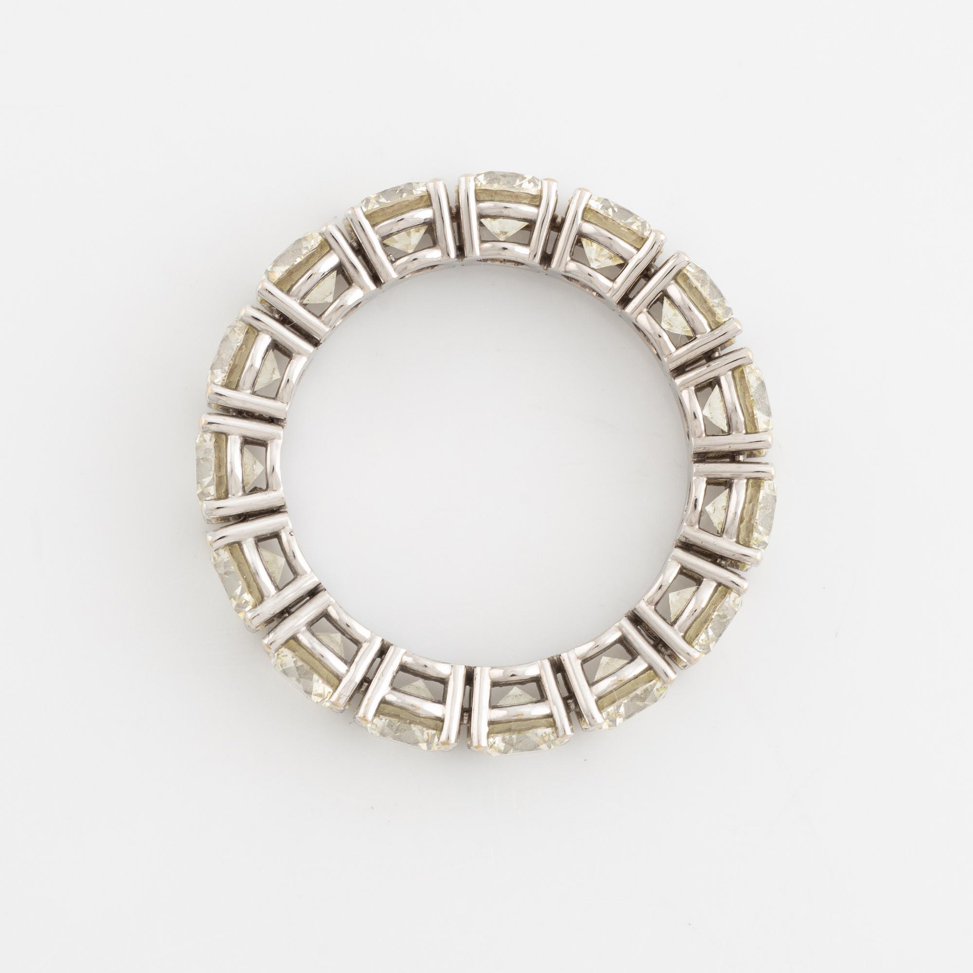Brilliant cut diamond eternity ring.