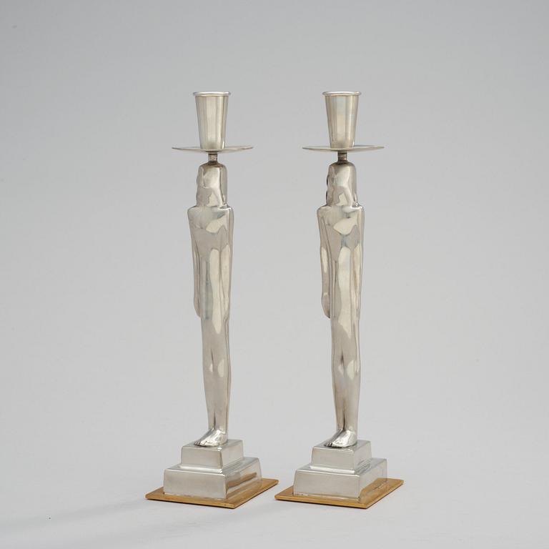 A pair of Edvin Öhrström 'Egyptian' pewter candlesticks, Svenskt Tenn, Stockholm 2001.