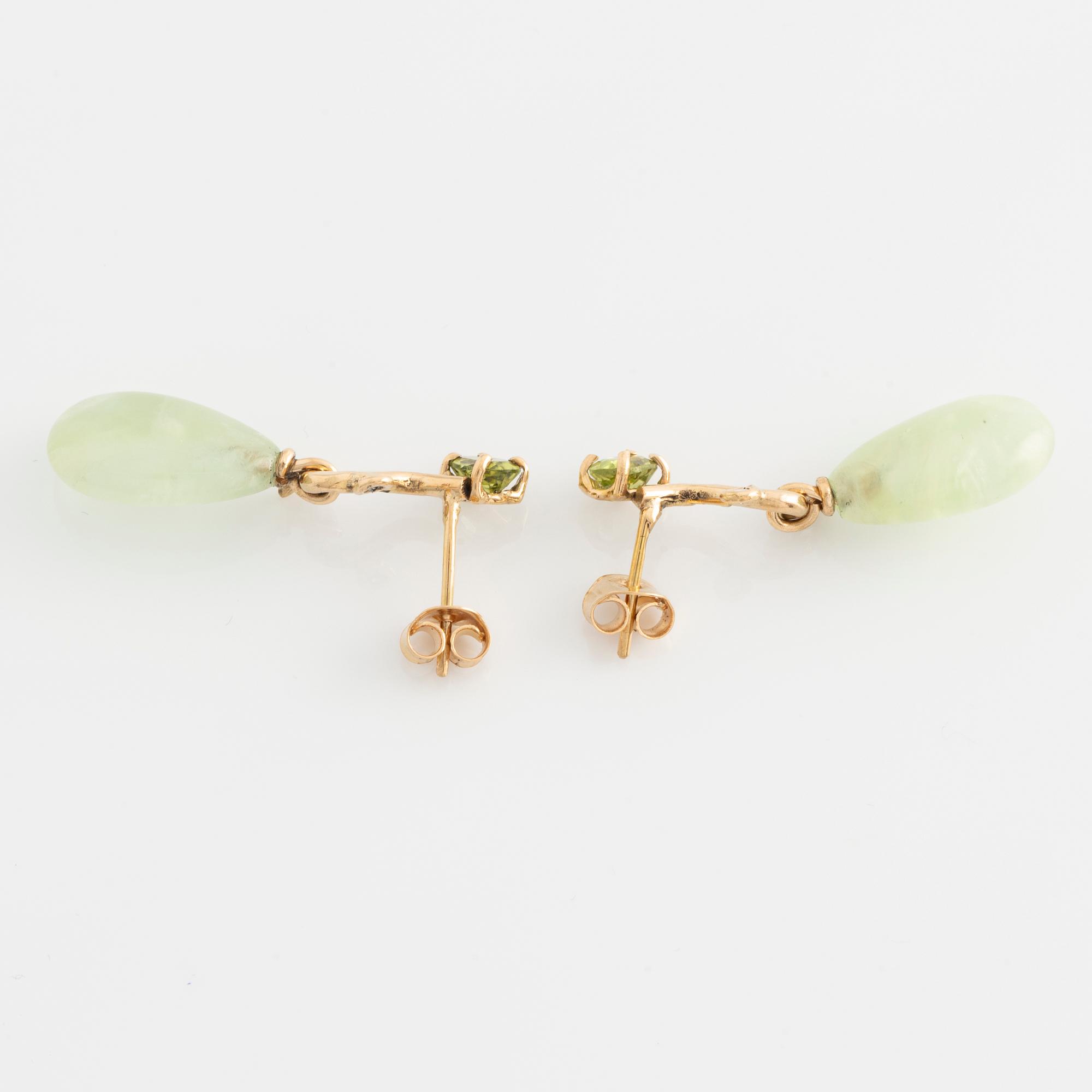 Earrings with pear-shaped prehnite, peridot, and brilliant-cut diamonds.