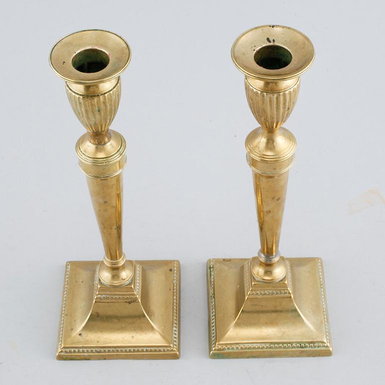 A pair of brass candlesticks, 19th century.