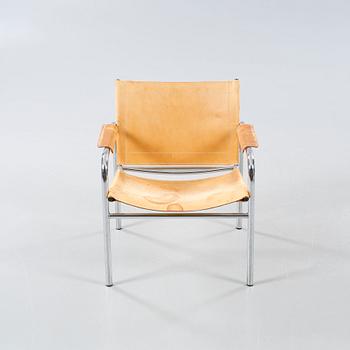 An armchair designed by Tord Björklund, named "Klinte" and made in the fourth quarter of the 20th century.