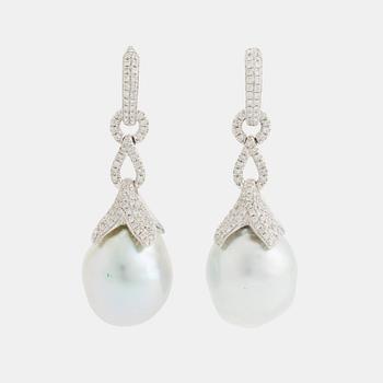 384. A pair of 18K white gold earrings set with cultured South Sea pearls and round brilliant-cut diamonds.