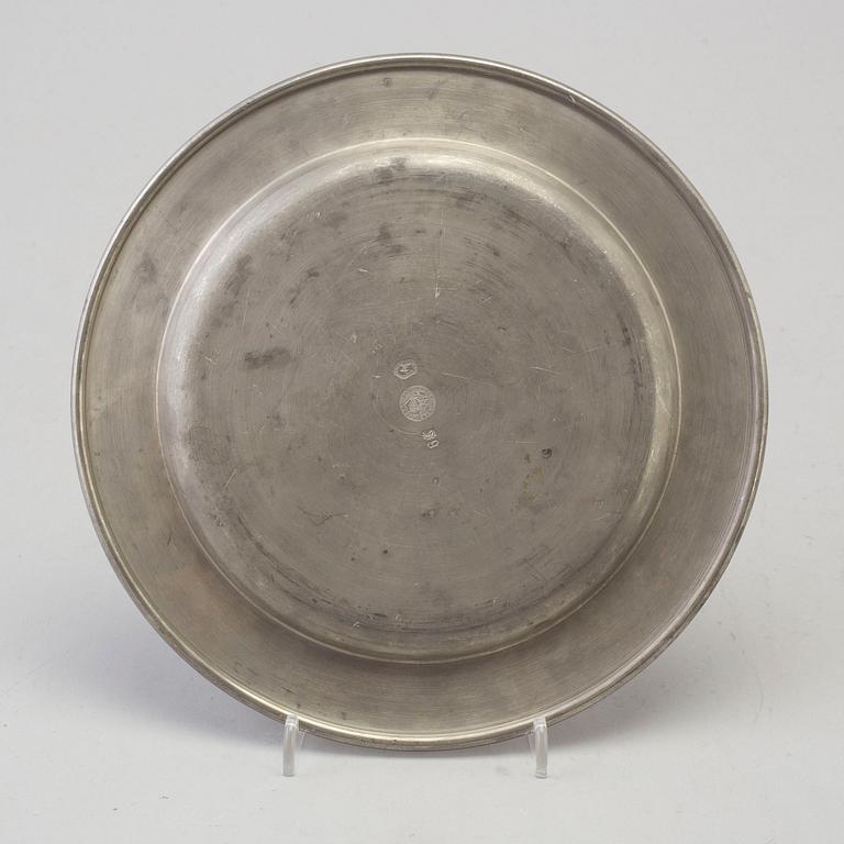 A set of seven 1960s pewter plates by Firma Svenskt Tenn.