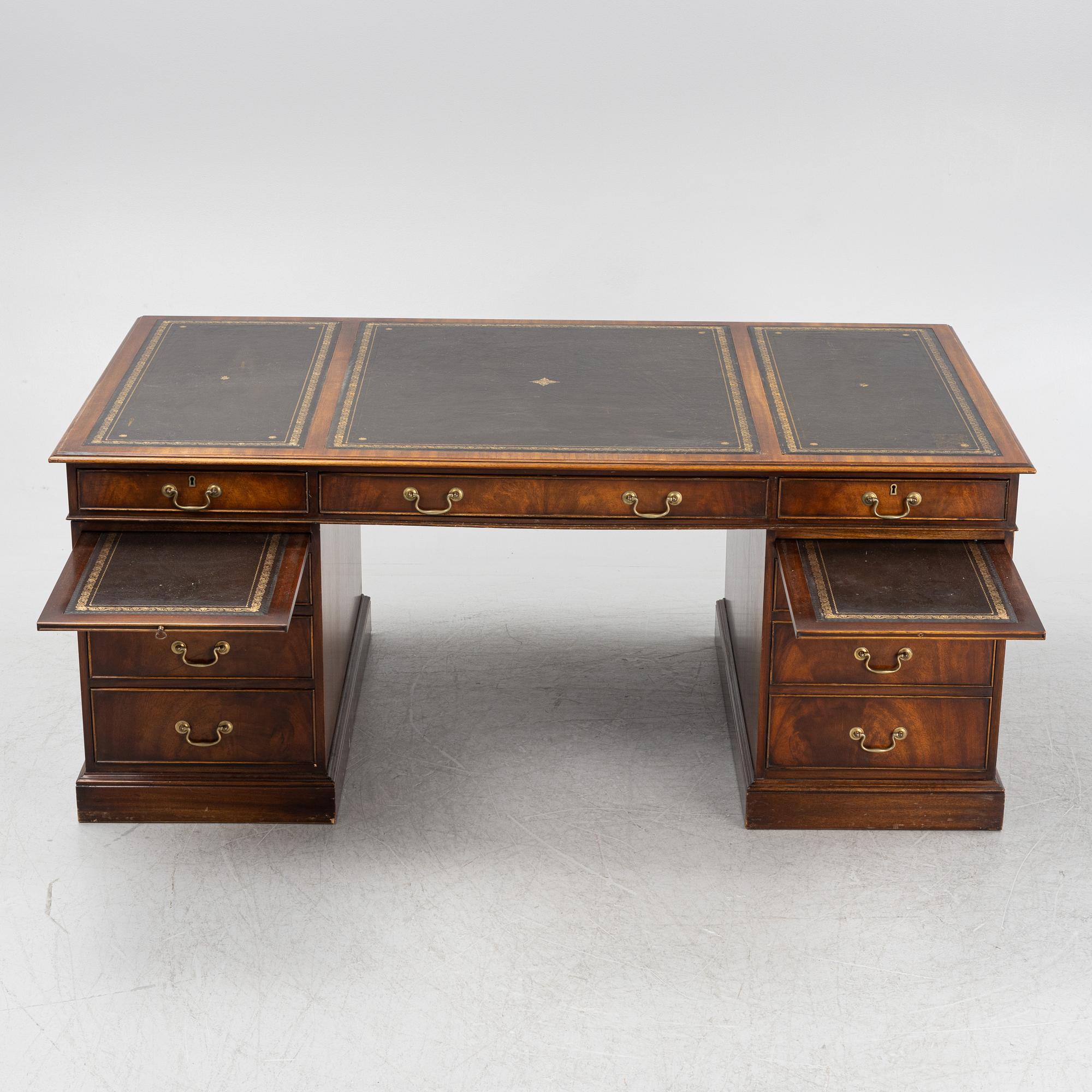 A mahogany desk, Reprodux, England, second half of the 20th Century.