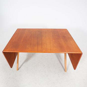 A Hans J Wegner "Savbukkebordet AT-303", teak and oak drop-leaf dining table, Andreas Tuck, Denmark 1950s-1960s.
