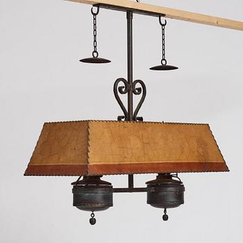 Nordiska Kompaniet, a patinated metal ceiling light for a Swedish "Sportstuge" interior, 1930's.