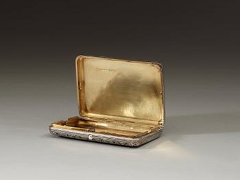 A Russian 19th century parcel-gilt and niello cigarette-case, makers mark of Ivan Chlebnikov, Moscow 1884.