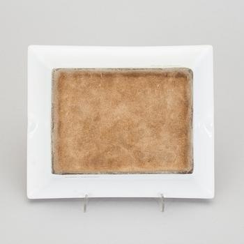 A Hermès porcelain ashtray.
