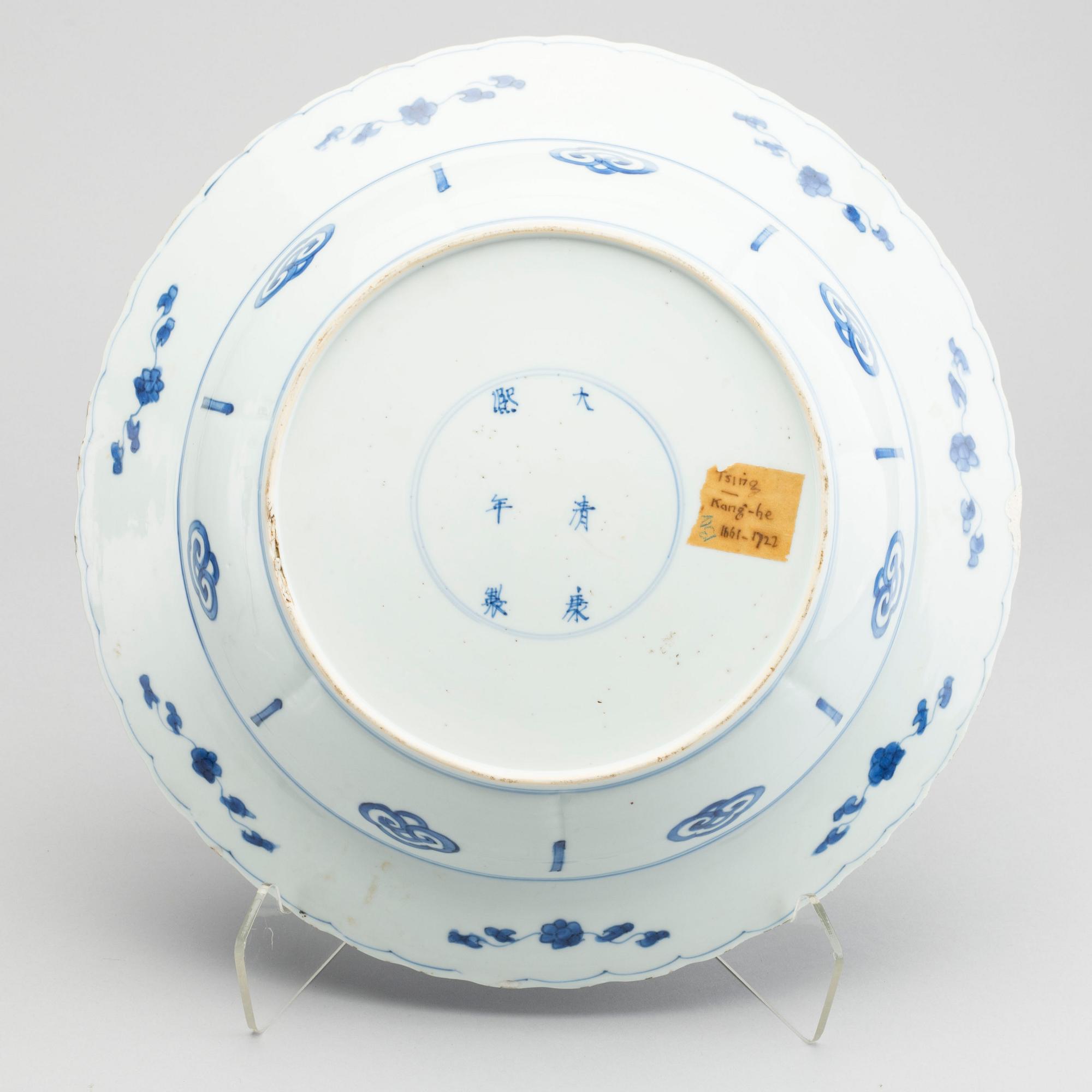 A large blue and white deep dish, Qing dynasty, with Kangxi six character mark and period (1662-1722).