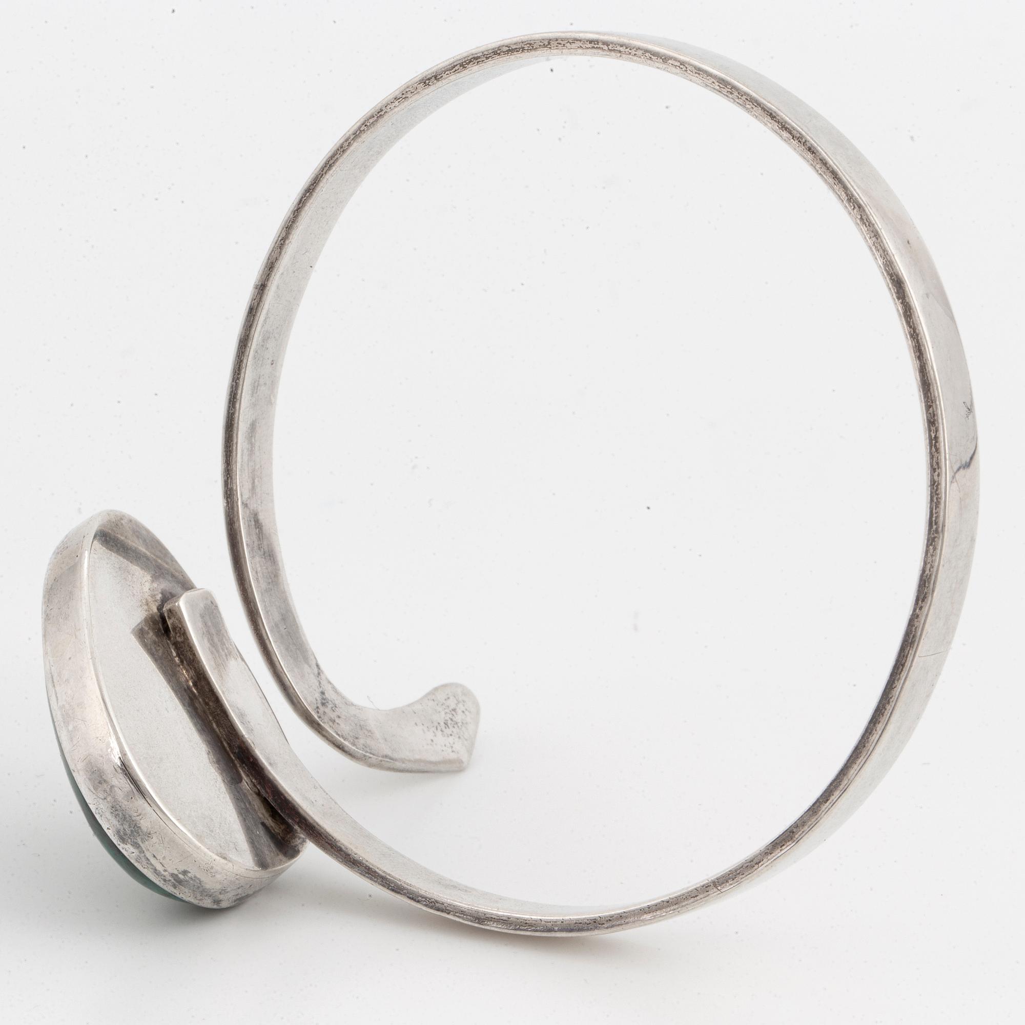 Isaac Cohen silver bangle with green stone.