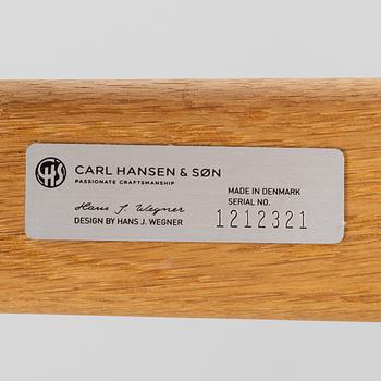 Hans J. Wegner, a CH26 chair, Carl Hansen & Son, Denmark, 21st century.