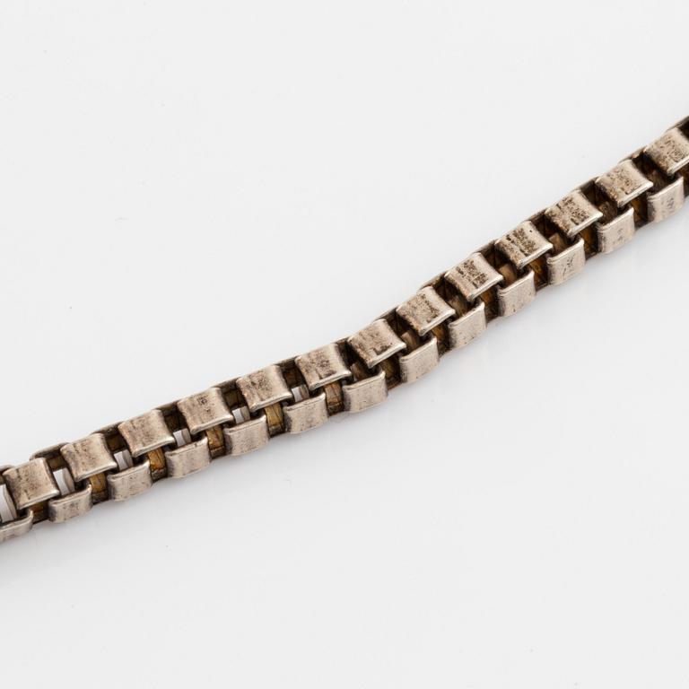 Silver necklace.
