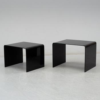 Two modern glass tables.