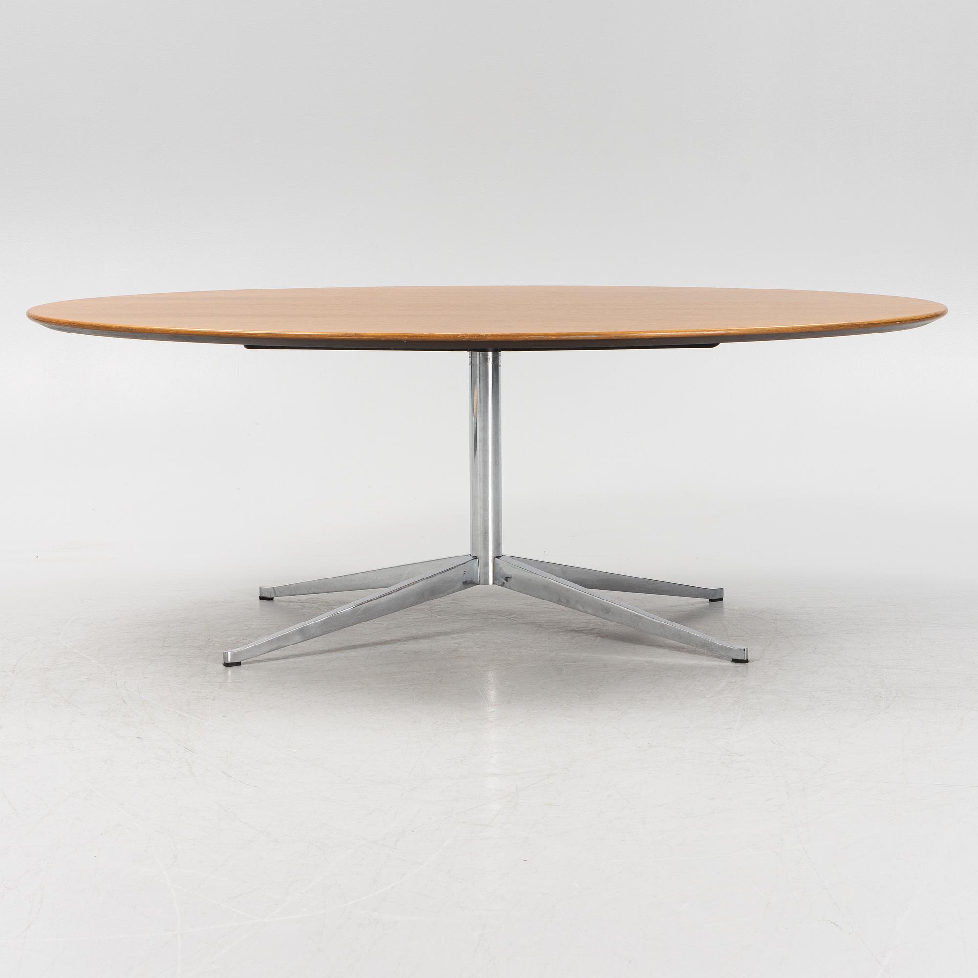 An 'Oval 96' table by Florence Knoll for Knoll International.