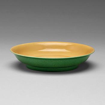 777. A yellow glazed dish, Ming dynasty, Xuande mark and of the period (1425-35).