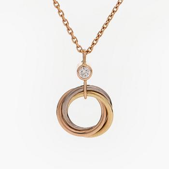 Cartier, an 18K gold 'Trinity Pendant' necklace with a brilliant-cut diamond.