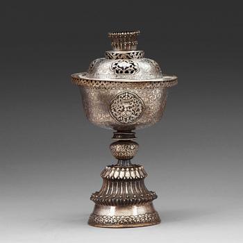 100. A Tibetan silver butter lamp with cover, 19th Century.