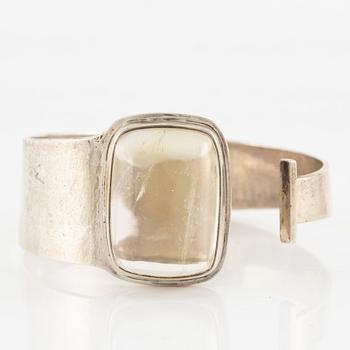 Bengt Liljedahl, arm ring, silver with light yellow stone.