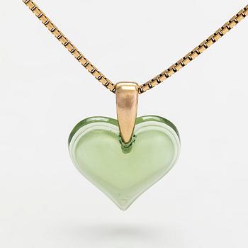 A Lalique heart pendant with an 18K gold chain.