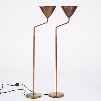 A pair of Swedish Modern brass uplights, 1940's.