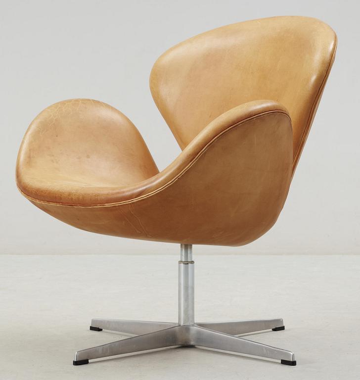 An Arne Jacobsen leather 'Swan' chair, Fritz Hansen, Denmark 1993.