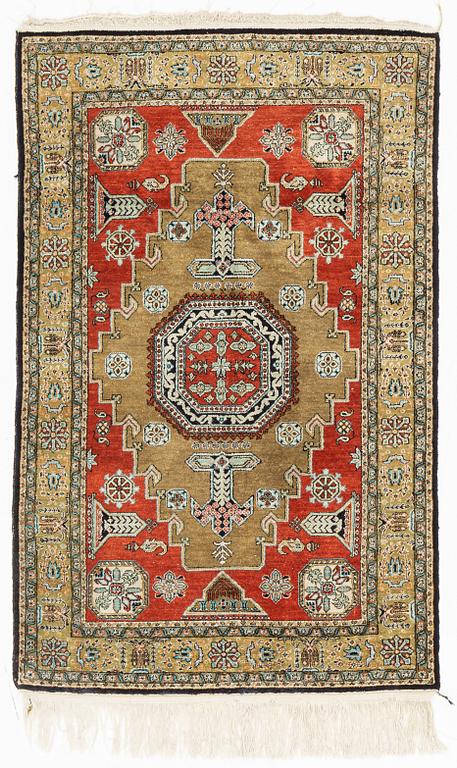 A rug, silk Quum, ca 121 x 76 cm.