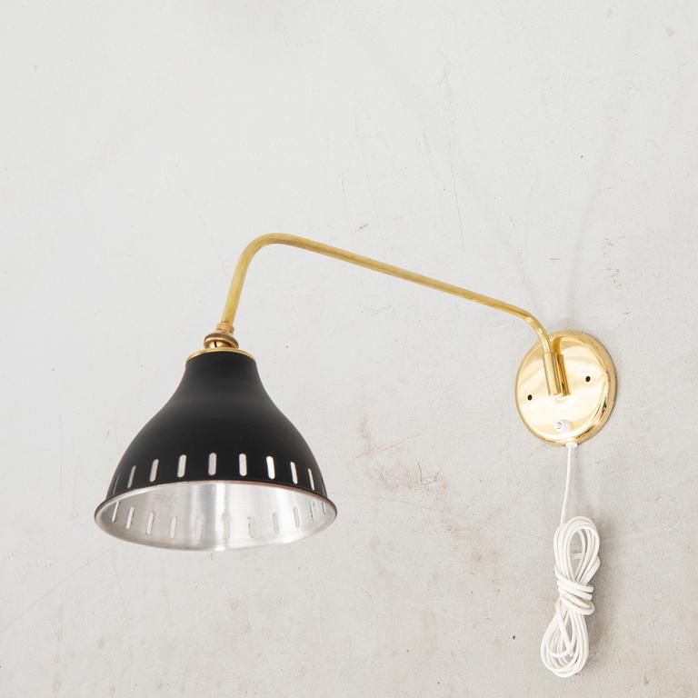 A bras wall lamp later part of the 20th century.