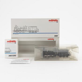 Märklin, a steam locomotive 3497 and car set no 4897, in boxes.