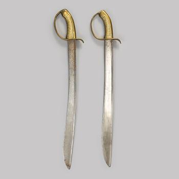 Two Swedish cutlasses 1846 pattern.