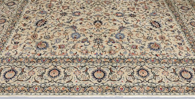 A Keshan carpet, signed, approx. 410 x 323 cm.