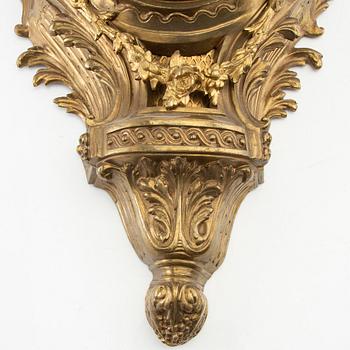 Wall clock in Louis XV style, circa 1900.