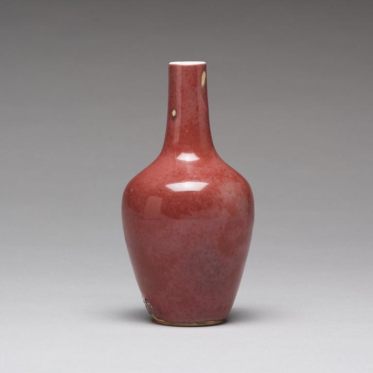 A sang de boef vase and bowl and an enamelled cup with cover and stand, Qing dynasty (1664-1912).