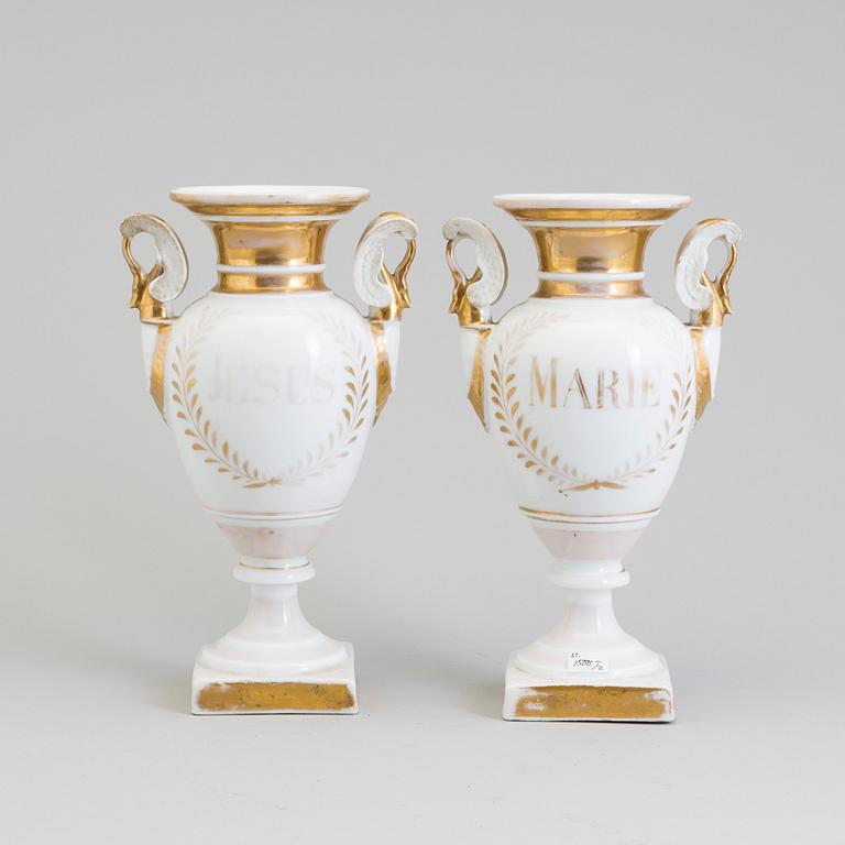 A pair of early 19th century French porcelain Empire vases.