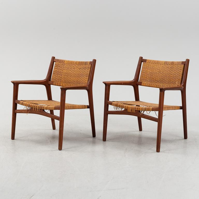 Hans J Wegner, a pair of teak and rattan "JH 516" easy chairs from Johannes Hansen, Denmark, 1950's/60's.