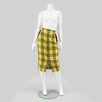 A checkered skirtby Jean Paul Gaultier.