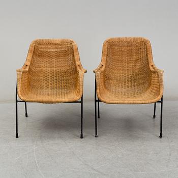 A 1950's pair of rattan easy chairs.