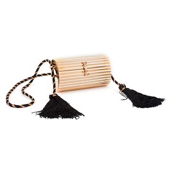 617. YVES SAINT LAURENT, a golden metal evening bag.