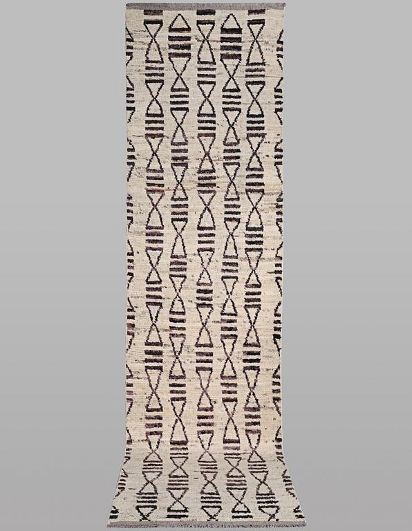 A runner carpet, Morocco, c. 374 x 80 cm.