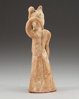 A potted figure of a dancer, Tang dynasty (618-907).