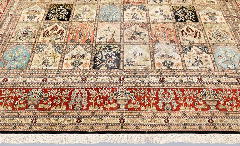 An oriental silk carpet, approx. 376 x 274 cm.