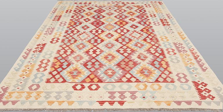 A Kilim carpet, ca 294 x 214 cm.