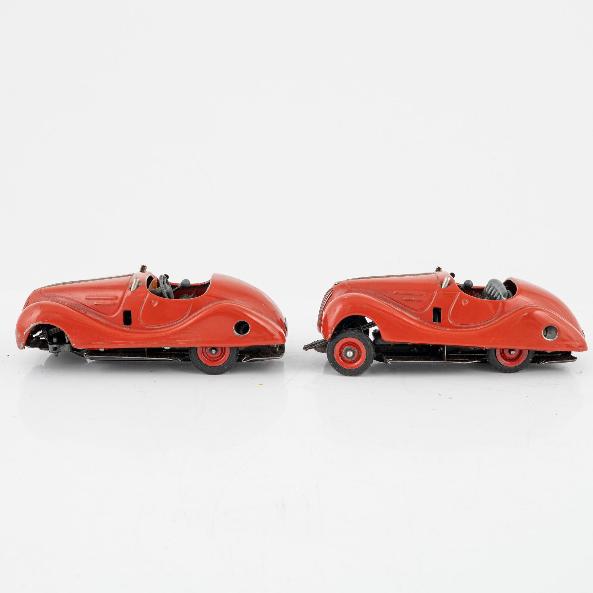 A set of five toy cars, mostly Schuco, Germany.