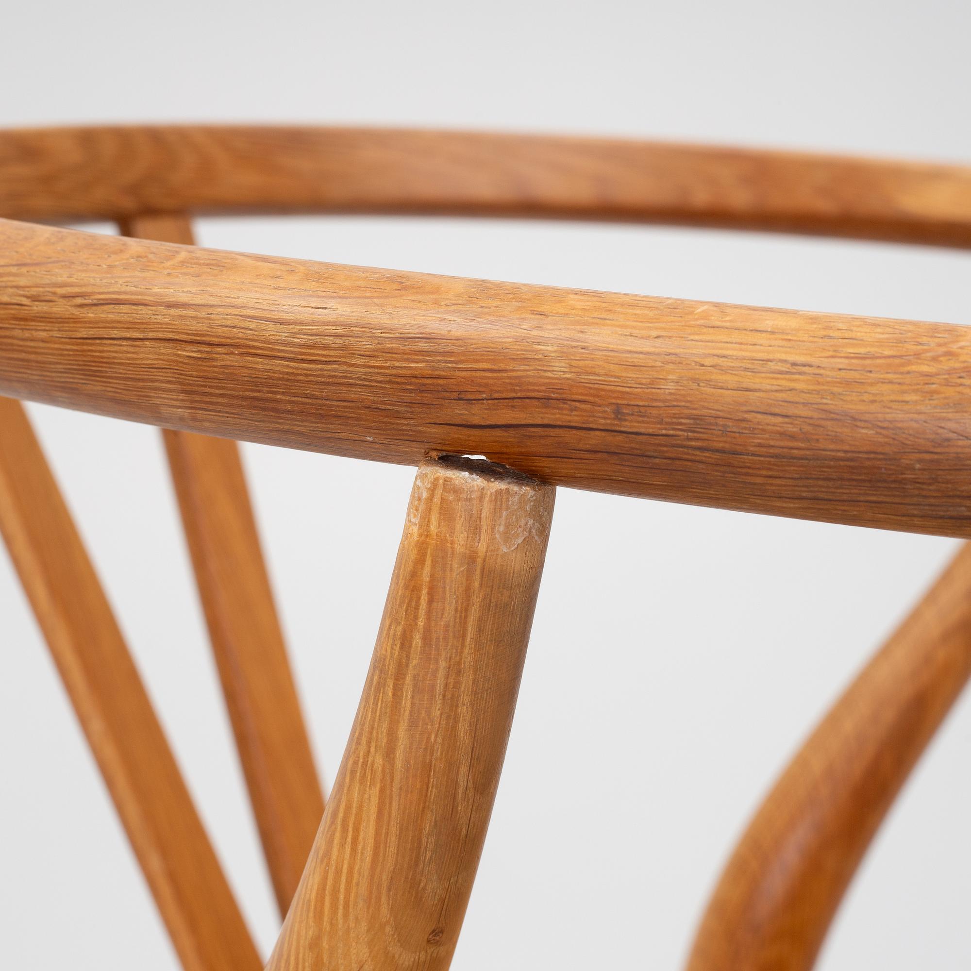 Hans J. Wegner, four model CH-24/ 'Wishbone' chairs, Carl Hansen, Odense, Denmark, second half of the 20th century.