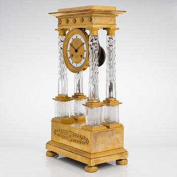 A french late Empire mantelpiece clock, first half of the 19th century.