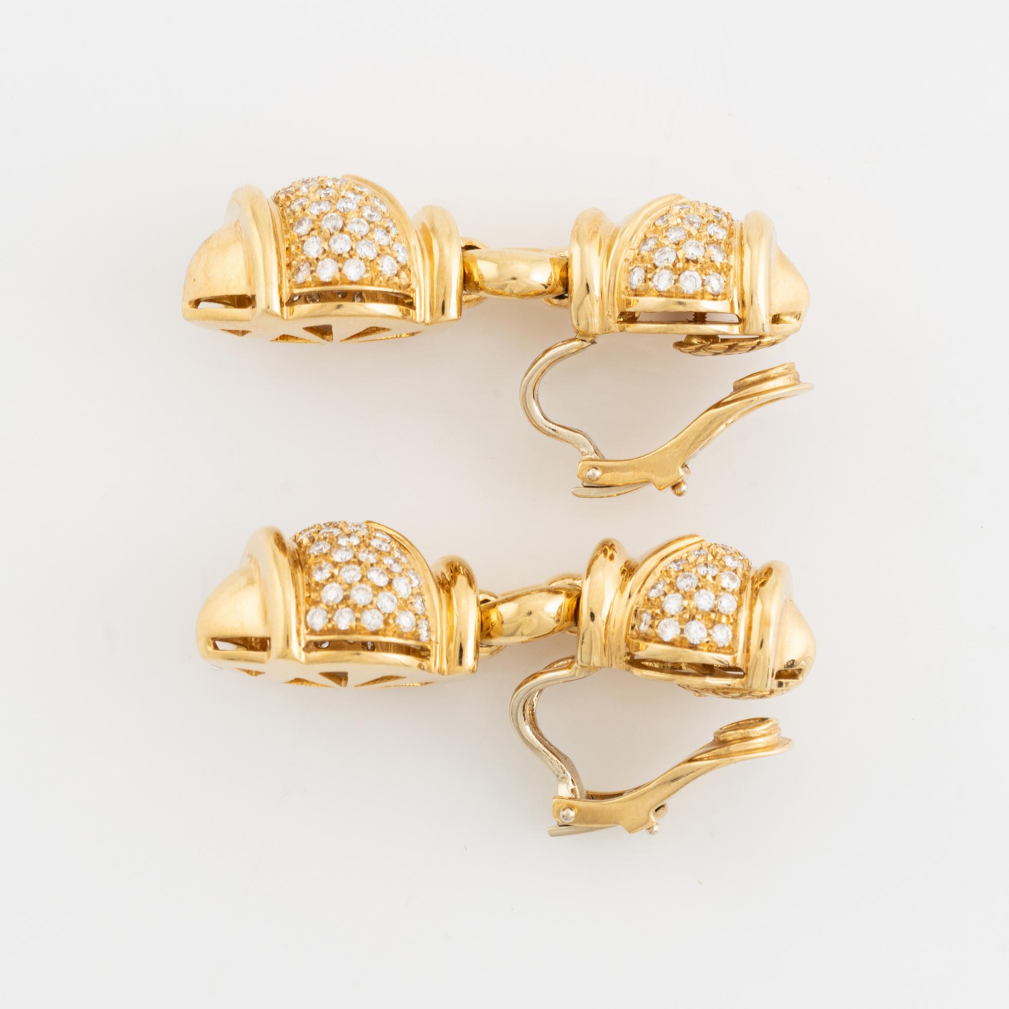 A pair of 18K gold earrings set with round brilliant-cut diamonds.