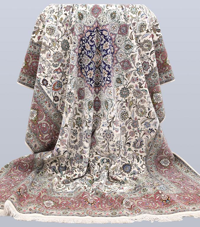 A part silk Tabriz carpet, 310 x 205 cm.