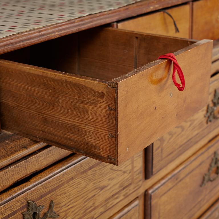 An oak rococo cabinet, mid 18th Century.